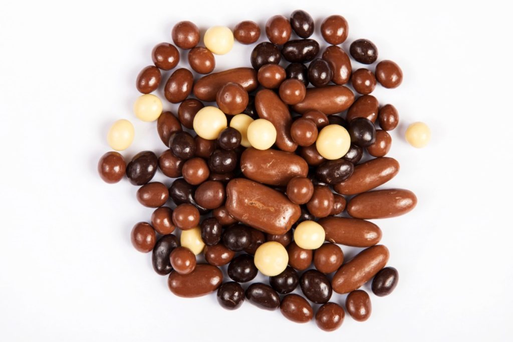 A collection of mushroom chocolate gummies of different shapes kept together