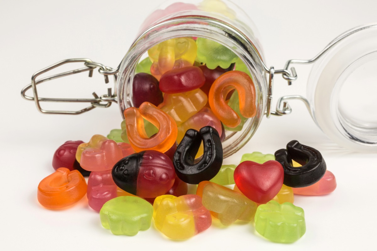 A collection of mushroom gummies in a jar