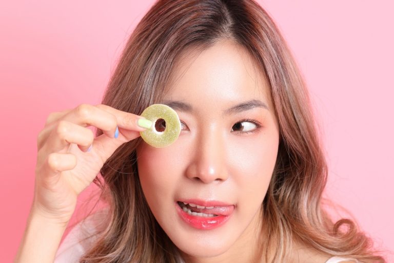 A lady is showing mushroom gummy