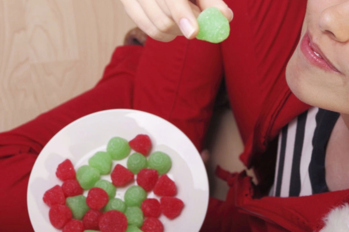 A woman is microdosing with mushroom gummies