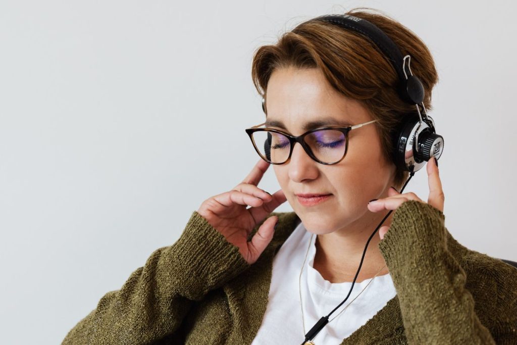 A woman listening to music after having shrooms