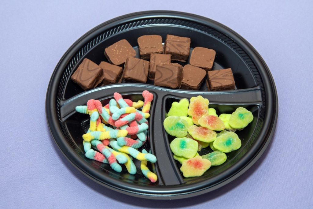 Mushroom gummies and mushroom chocolates arranged on a plate